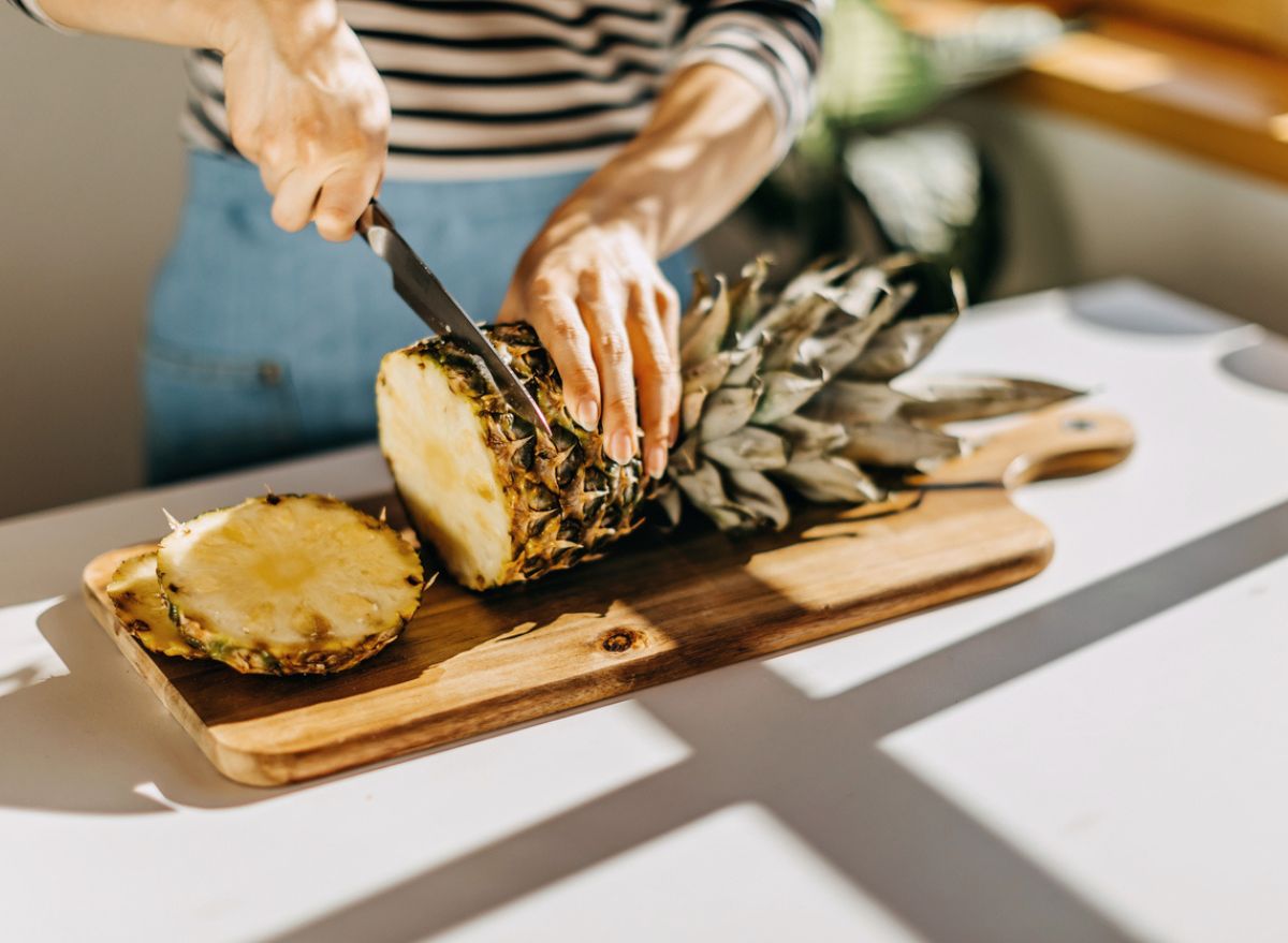 Cutting pineapple