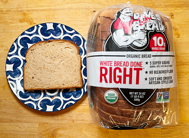 daves killer white bread loaf with slice on printed plate 