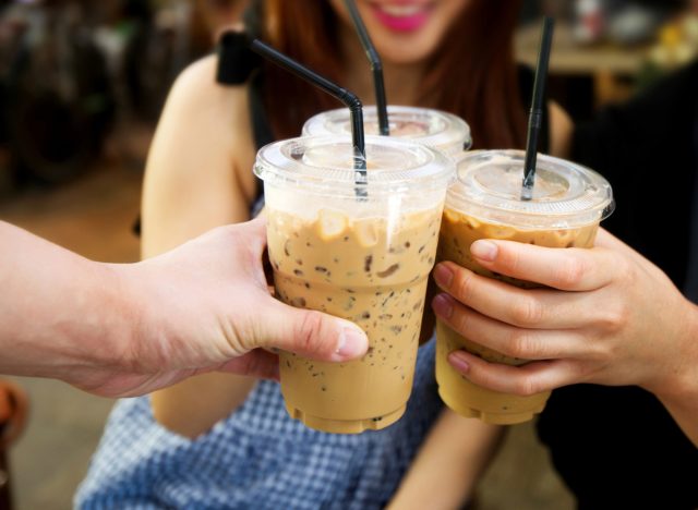 friends holding iced coffee