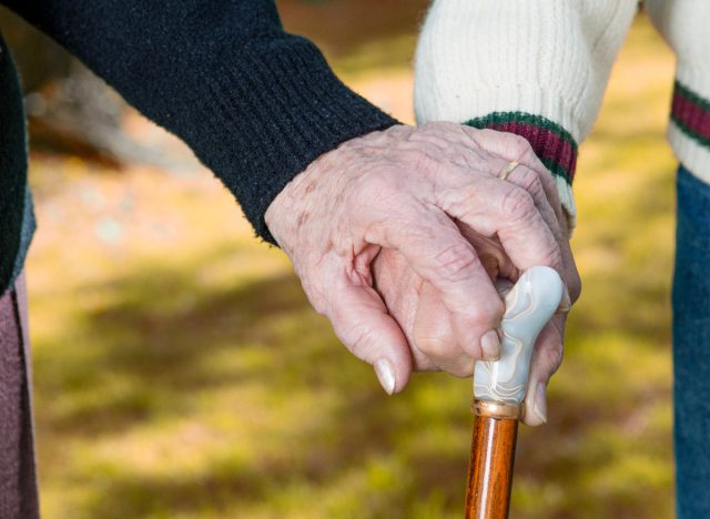 the world's oldest couple closeup holding hands