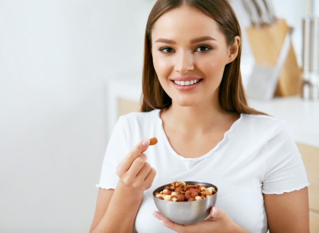 happy women eating nuts