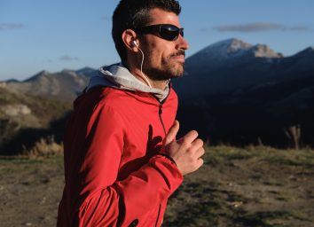 middle-aged fit man runs outdoors to address sleep apnea