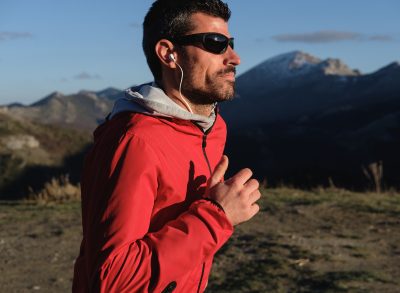 middle-aged fit man runs outdoors to address sleep apnea