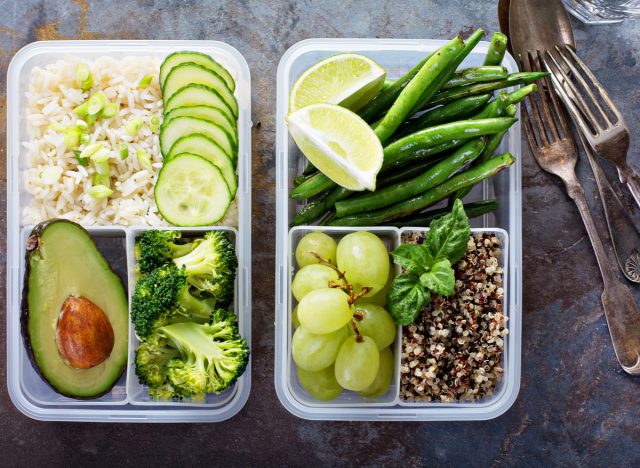 meal prep containers with rice, vegetables, grapes, quinoa and avocado