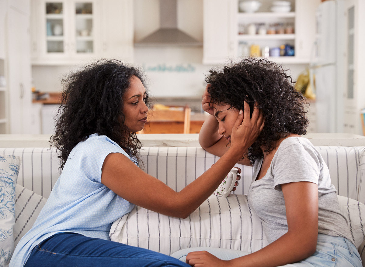 mother and daughter on couch talking about mental health