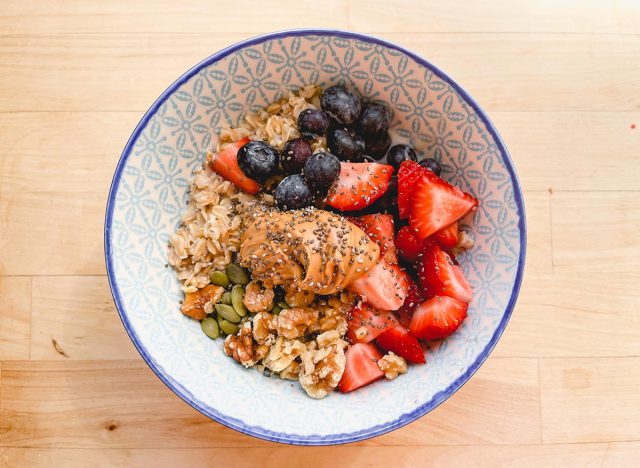 peanut butter oatmeal with nuts seeds and berries