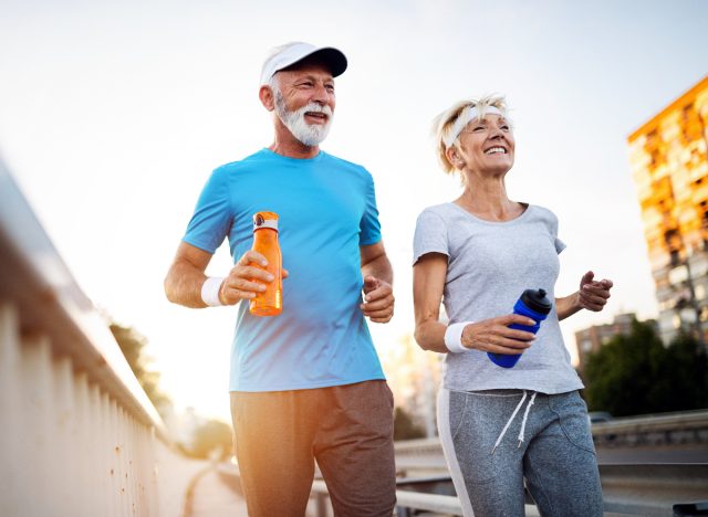 active old couple running outside