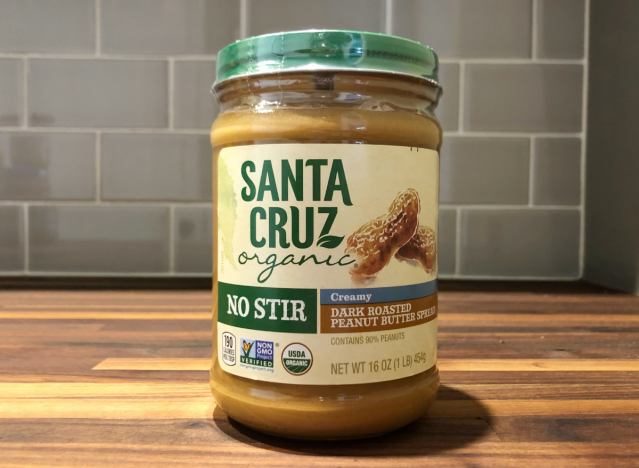 santa cruz peanut butter jar on a table.