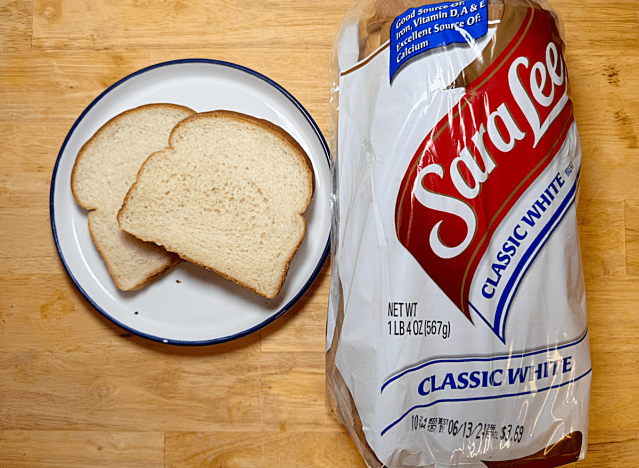 loaf of sara lee white bread with two slices on a plate 
