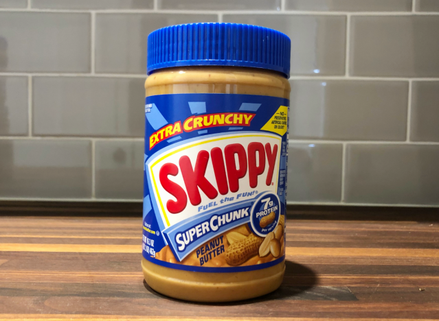 skippy peanut butter jar on a table.
