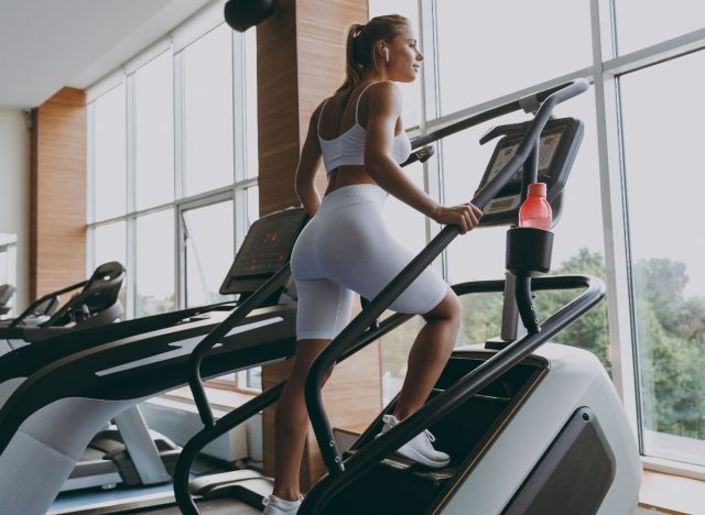 young woman doing stair climber to jumpstart weight loss