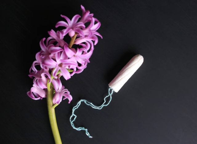 organic tampon next to flower