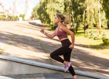 woman running up steps for cardio workout