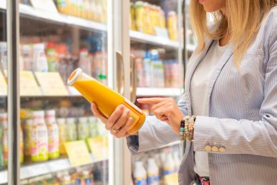 woman reading nutrition label