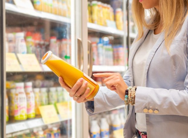 woman reading nutrition label