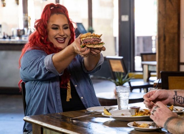 Host Claudia Sandoval, Charro Steak Owner Carlotta Flores and Chef-Partner Gary Hickey sample the Charro Burger