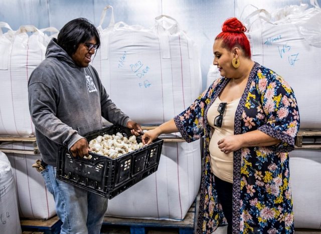 Host Claudia Sandoval and Joshua Preston in San Xavier Coop Farm