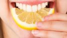 teeth biting into lemon