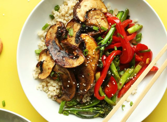 plate of mushroom stir fry on a yellow table