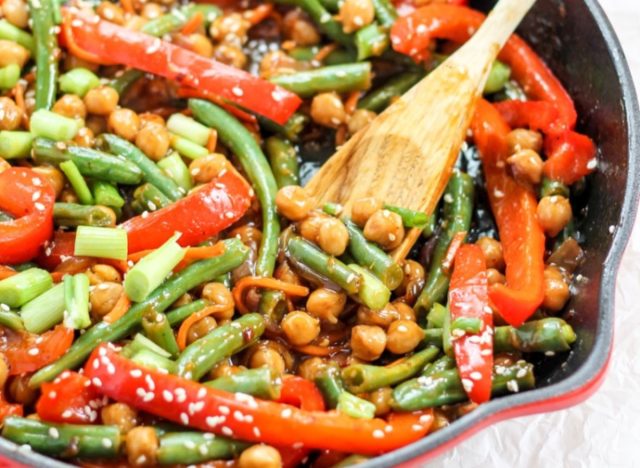 chickpea stir-fry cooking in a pan