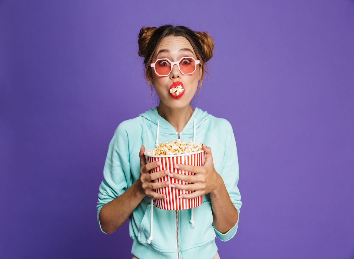 Woman eating popcorn