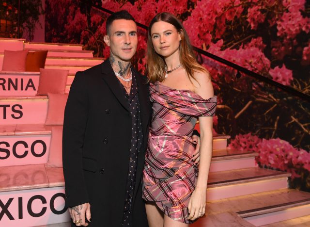 Adam Levine and Behati Prinsloo pose together in steps at the LA launch party at CALIROSA Tequila