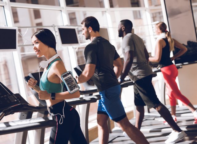 athletes work out, treadmill challenge in gym