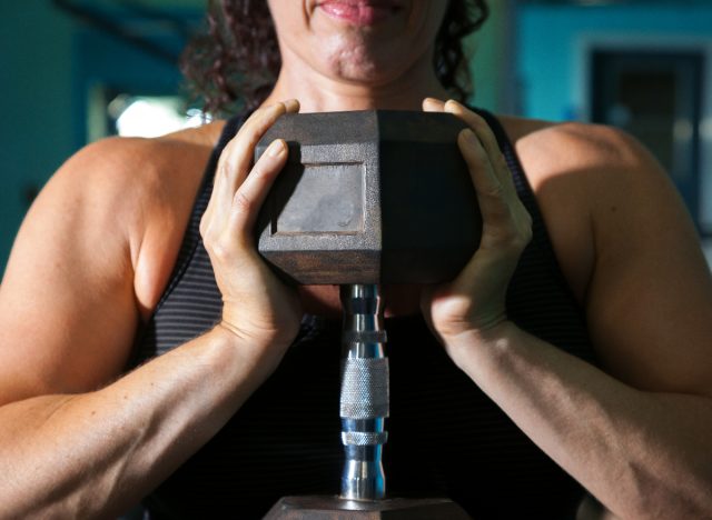 woman closeup dumbbell goblet squat