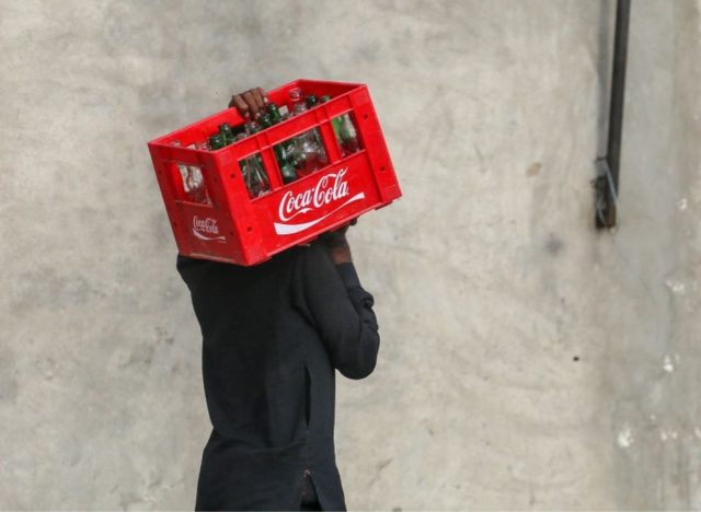 coca cola carrying soda