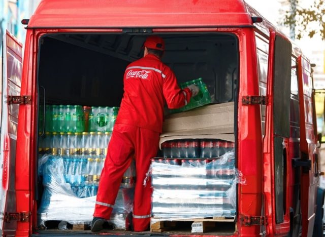 coca cola employee unloading truck