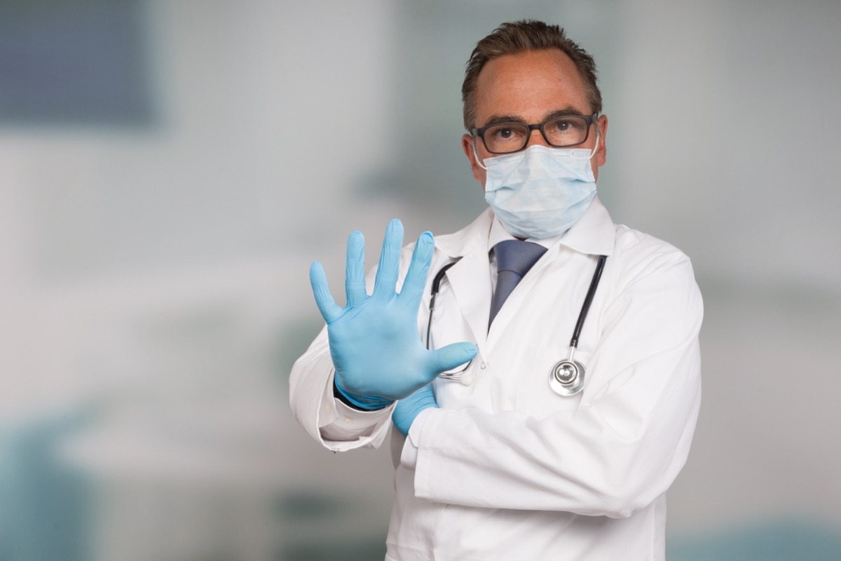 Doctor,With,Medical,Face,Mask,And,Medical,Gloves,Shows,Stop