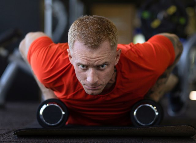 Fit Men Feet Elevated Dumbbell Push Ups