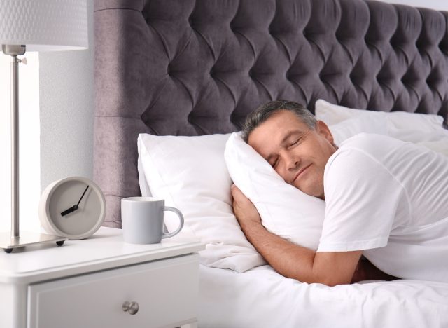 Happy man sleeping in his clean home leading an incredibly healthy lifestyle