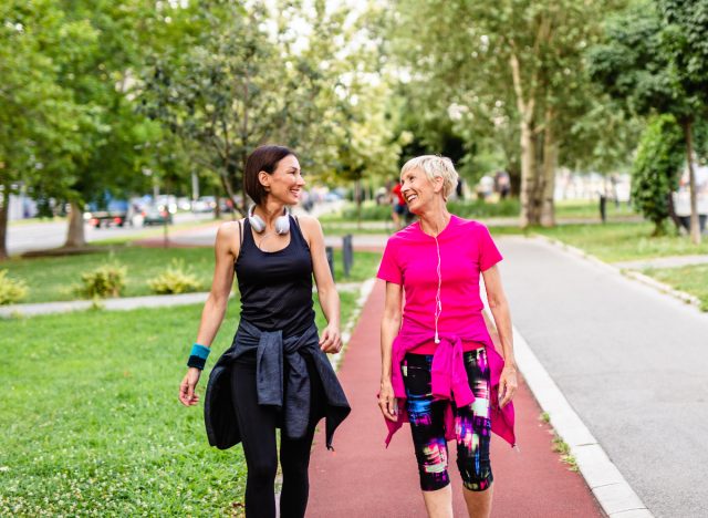 Two women take a walk outdoors without losing weight 