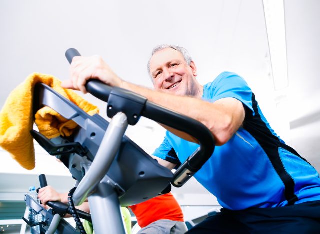man doing exercise bike cardio workout for faster weight loss