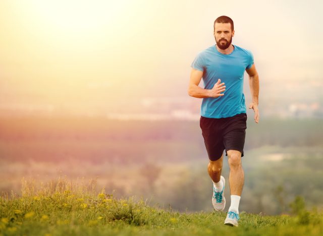 man jogging outdoors uphill