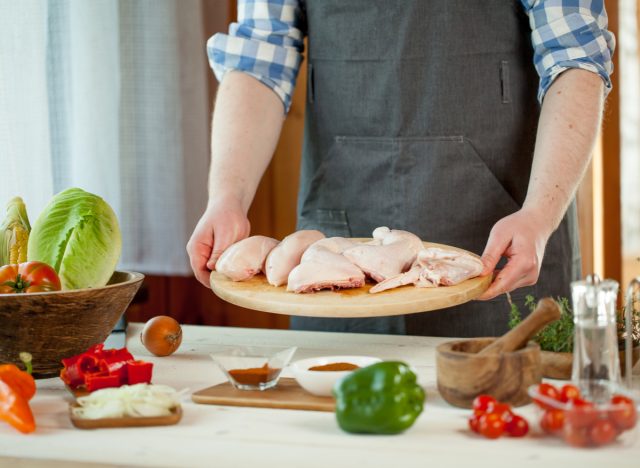 man preparing chicken