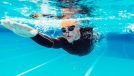 man with bad back swimming for exercise to help with pain