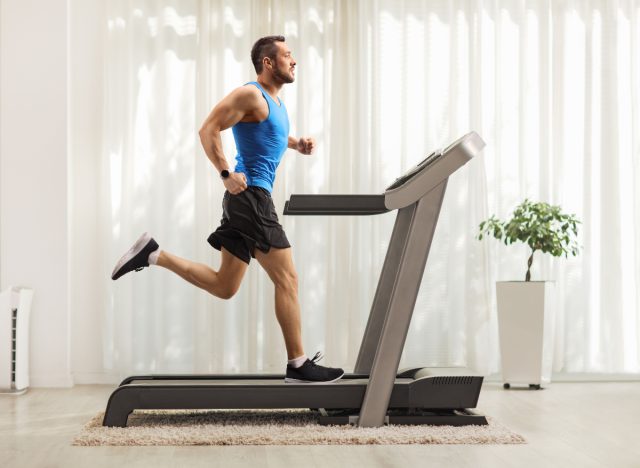 man doing treadmill sprint, fat-burning workout at home