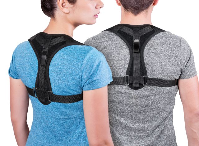 man and woman wearing posture correctors for back