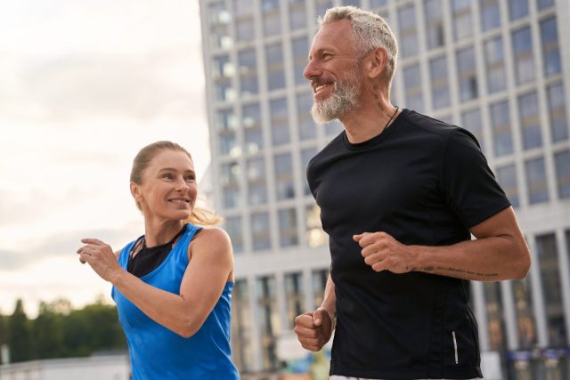 senior couple jogging outdoors