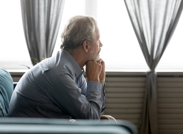 senior man sitting on the couch at home