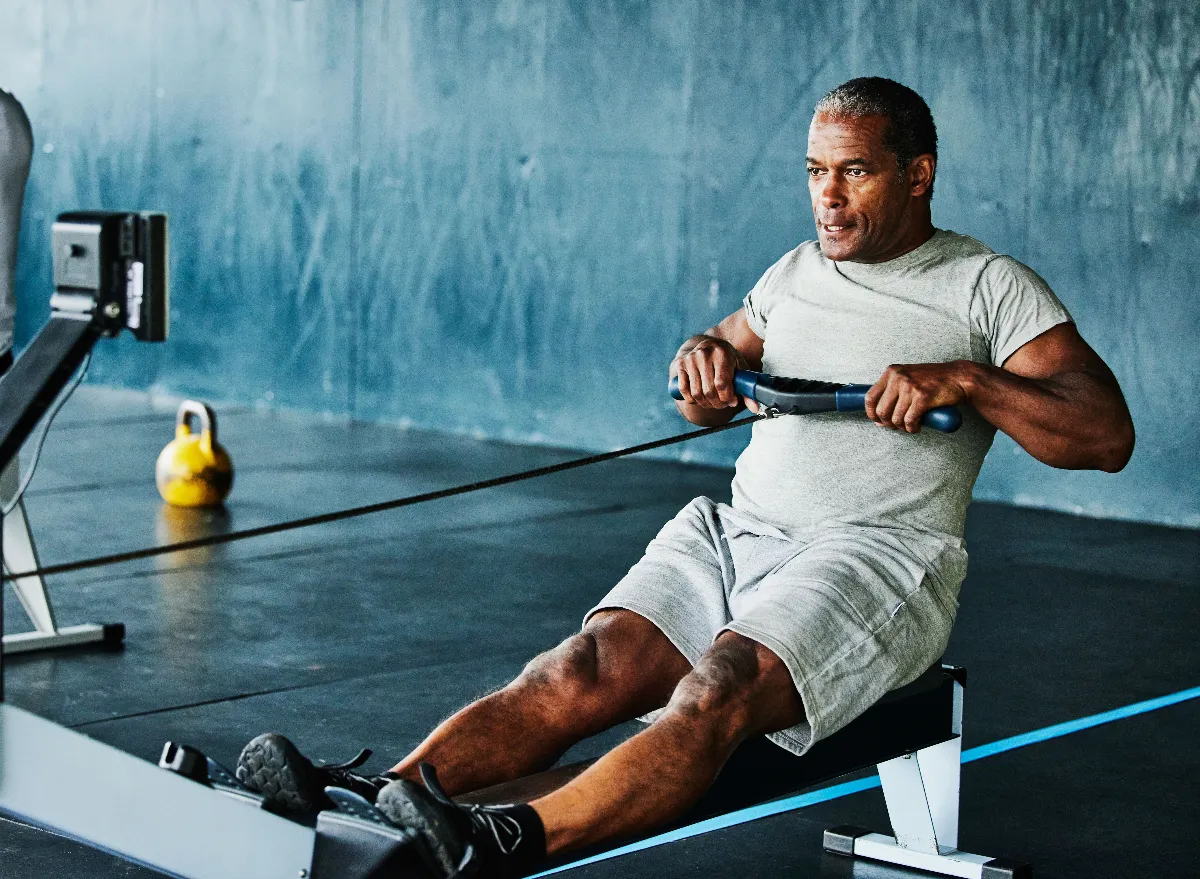 mature man doing seated row in the gym to reverse aging after 60