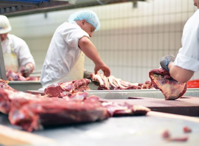 men working at a meat processing plant