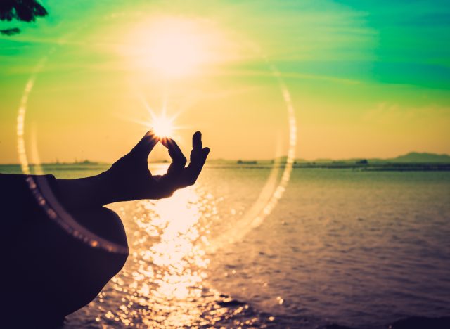 meditation concept, outdoors by the water at sunset