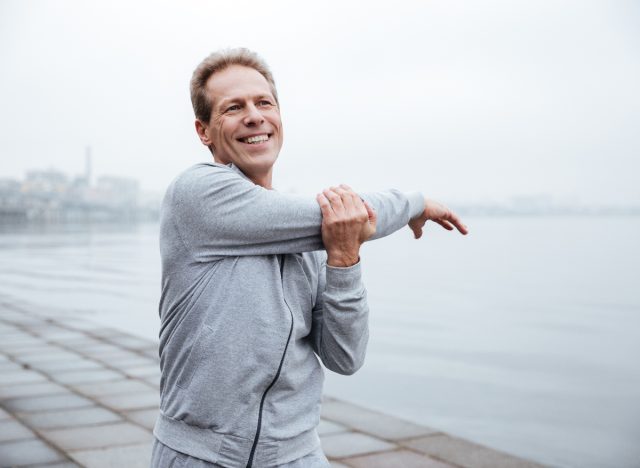older man stretches, active lifestyle to prevent heart failure