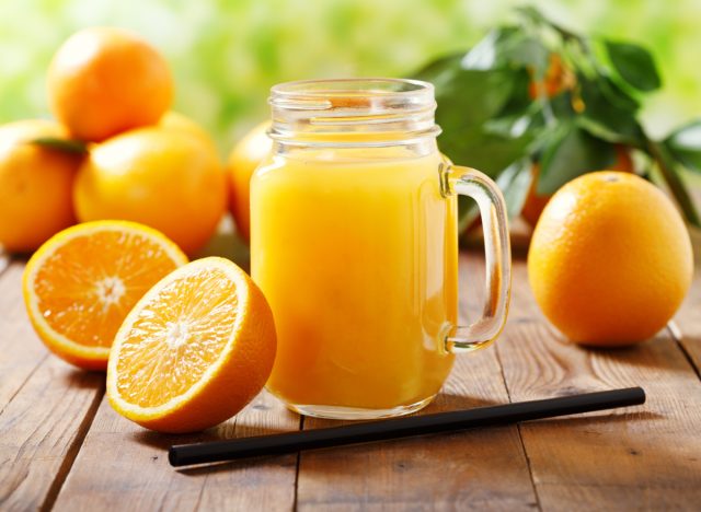 orange juice in mason jar mug, concept of foods preventing you from losing weight