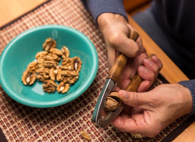 person eating walnuts