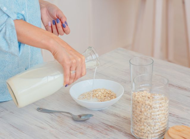 pouring milk into oats
