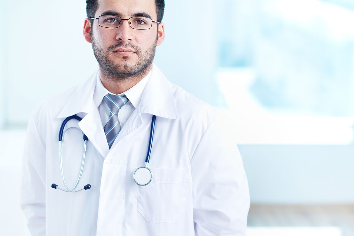 Portrait,Of,Serious,Doctor,With,Stethoscope,Looking,At,Camera
